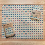 Beeswax wrap with floral pattern on a wooden surface