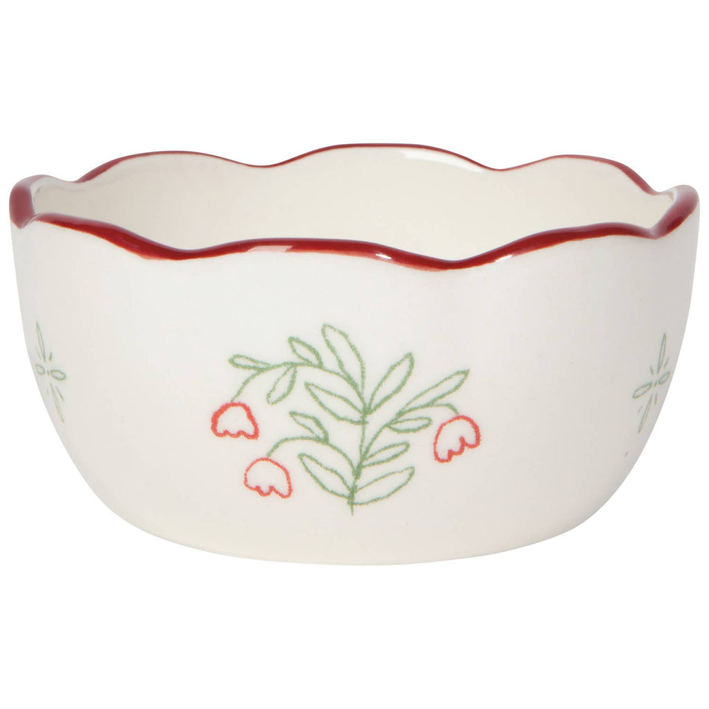 White ceramic bowl with red rim and floral design on a white background