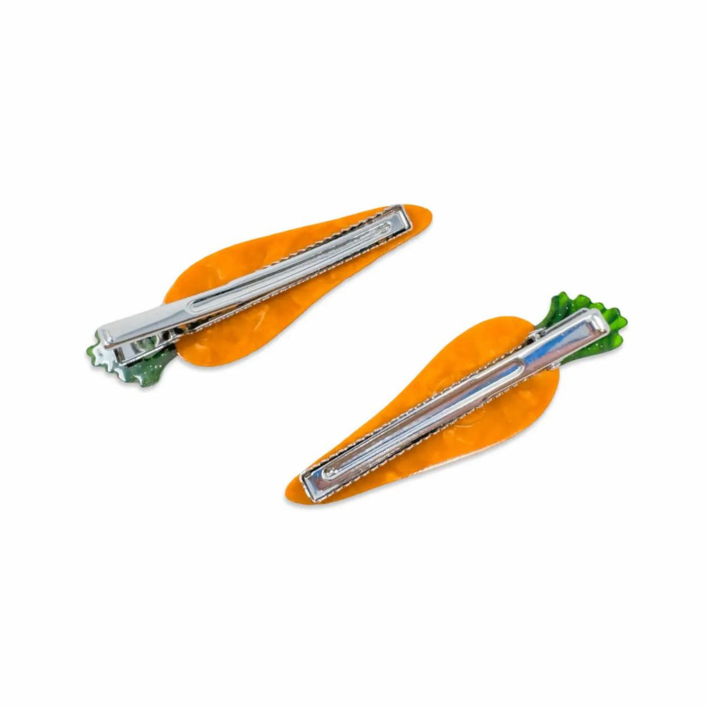 Two carrot-shaped hair clips on a white background