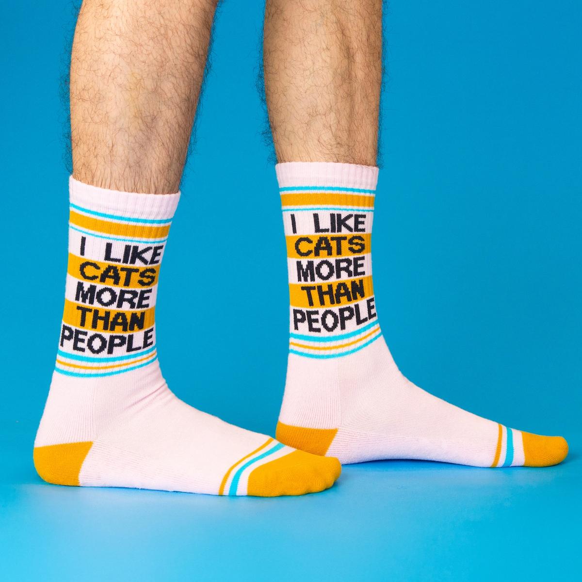 White socks with colorful text and stripes on a blue background
