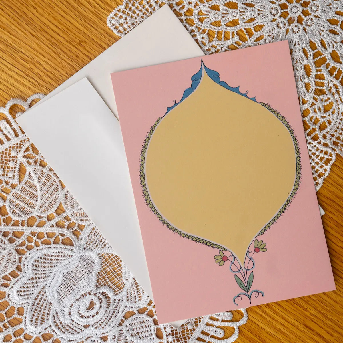 Pink and Yellow Oval card on a lace doily background