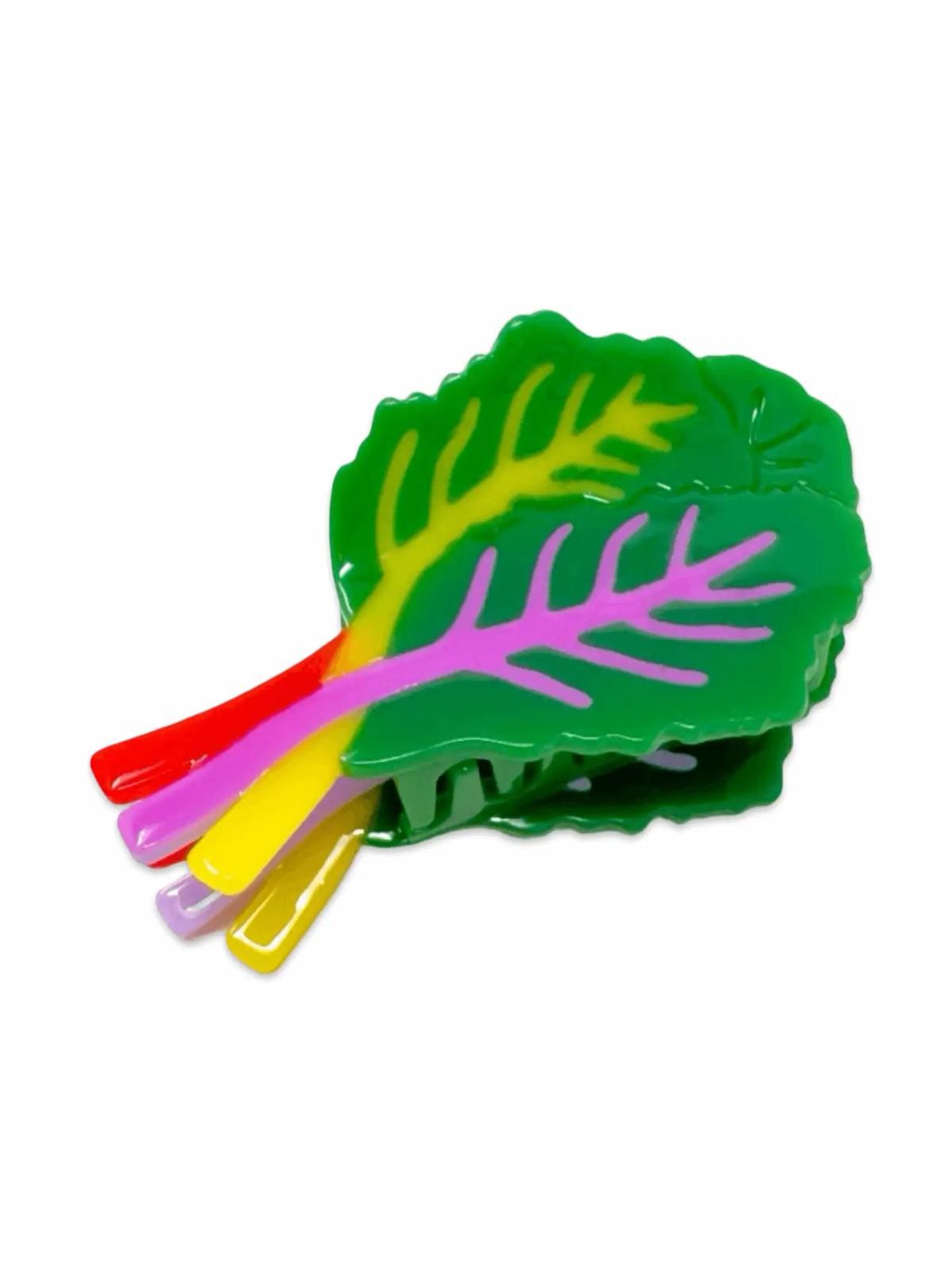 Colorful leaf-shaped hair clips on a white background