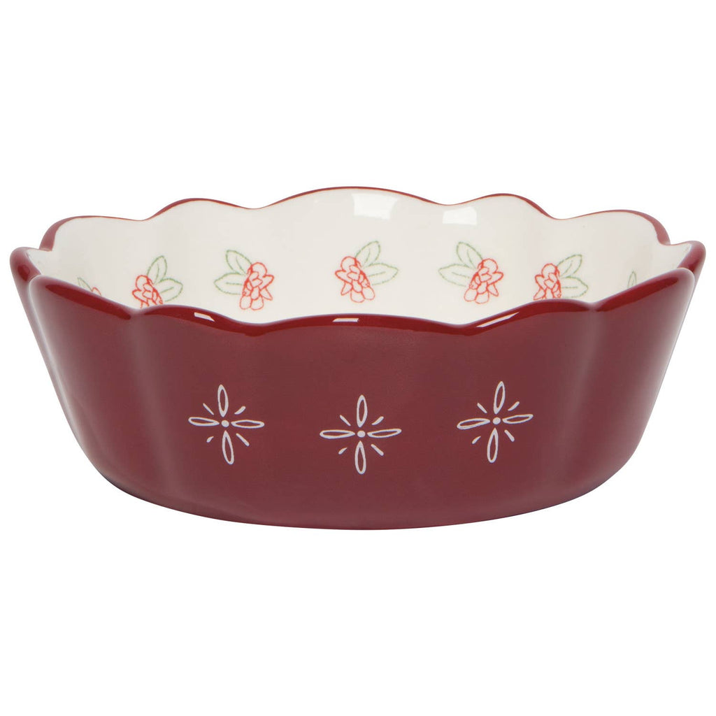 Red ceramic dish with floral patterns on a white background