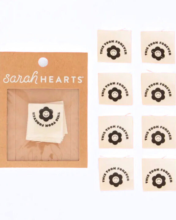 Packaging of 'This Took Forever' stickers by Sarah Hearts with a small sample on a white background.