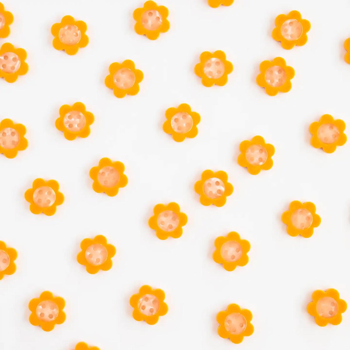 Pattern of small orange flowers on a white background