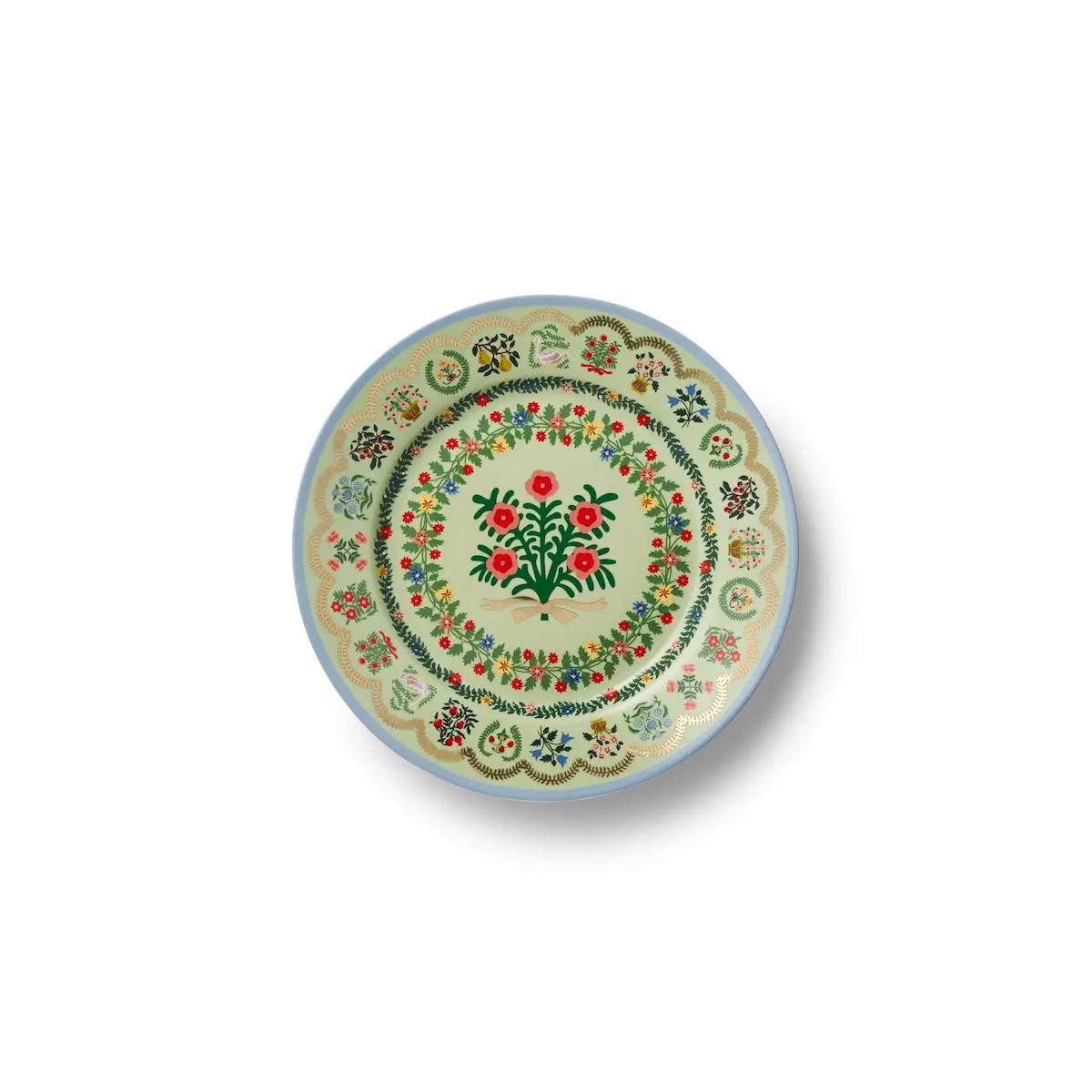 Decorative plate with floral and botanical design on a white background