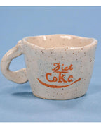 white speckled cup with diet coke logo