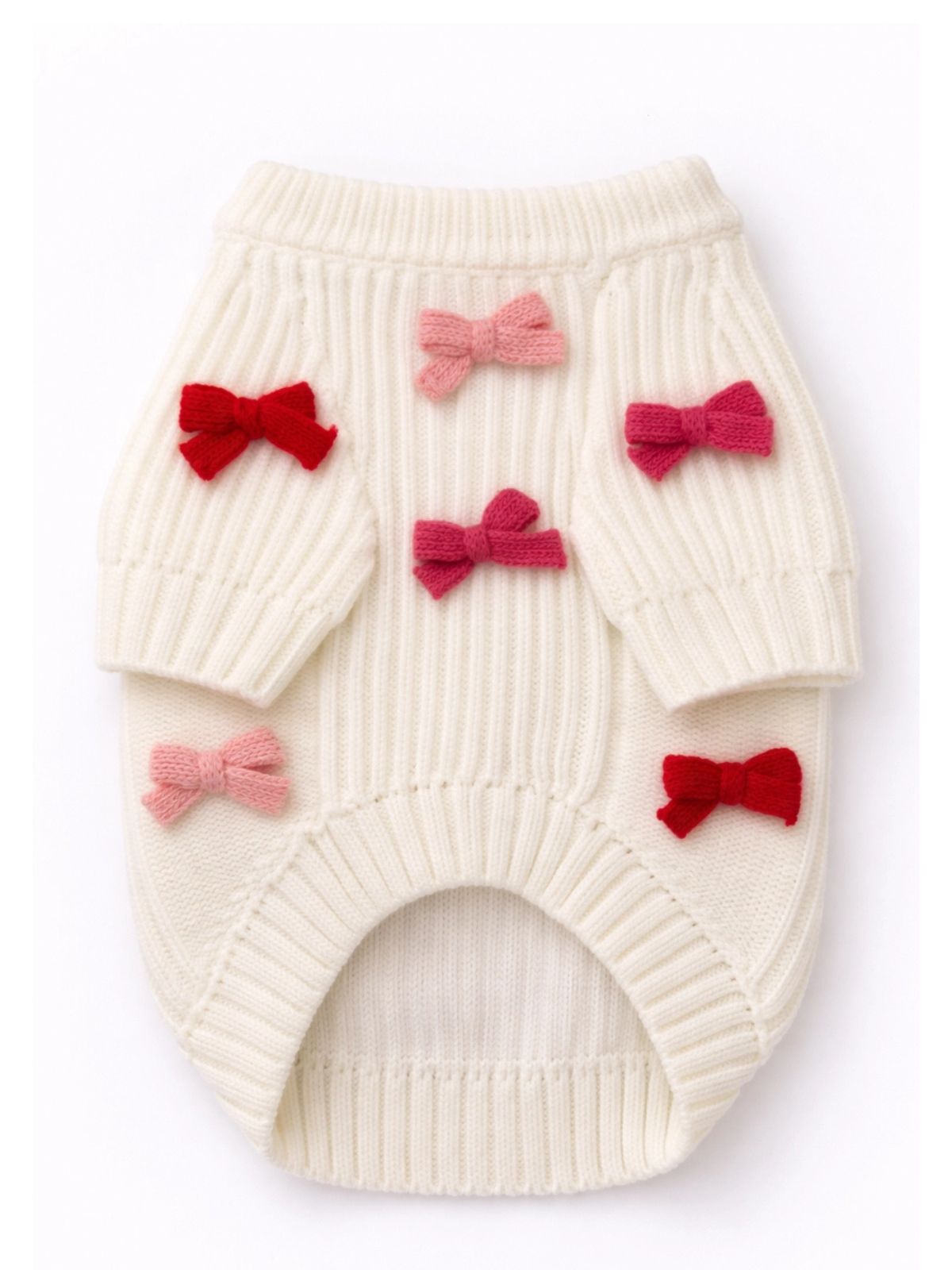 White ribbed dog sweater with red and pink bows on a white background