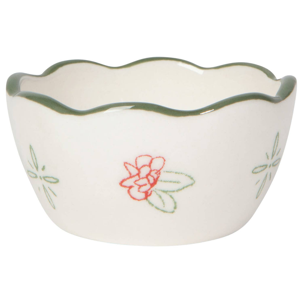 Small white ceramic bowl with floral design on a white background