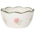 Small white ceramic bowl with floral design on a white background