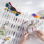 Person working on an embroidery project with patterned fabric of people in dresses with colorful embroidery supplies.