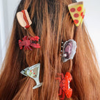 Hair accessories shaped like food items on a person's head