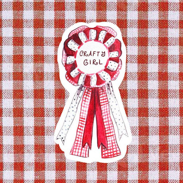 Decorative ribbon with 'Crafty Girl' text on a red and white checkered background