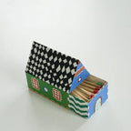 Matches in a colorful matchbox with a checkered lid on a white background