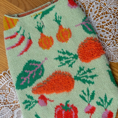Embroidered fabric with vegetable pattern on a lace doily