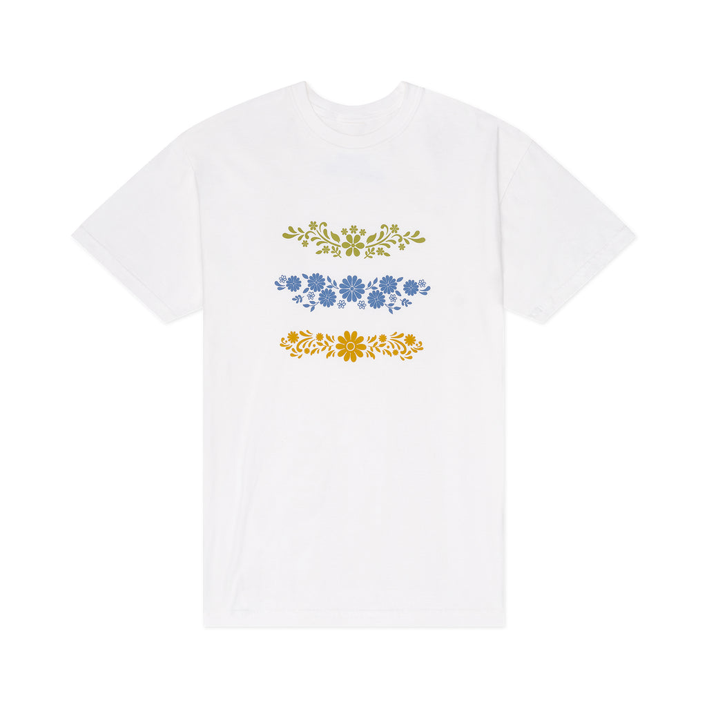 White t-shirt with floral Pyrex designs in blue and yellow on a white background