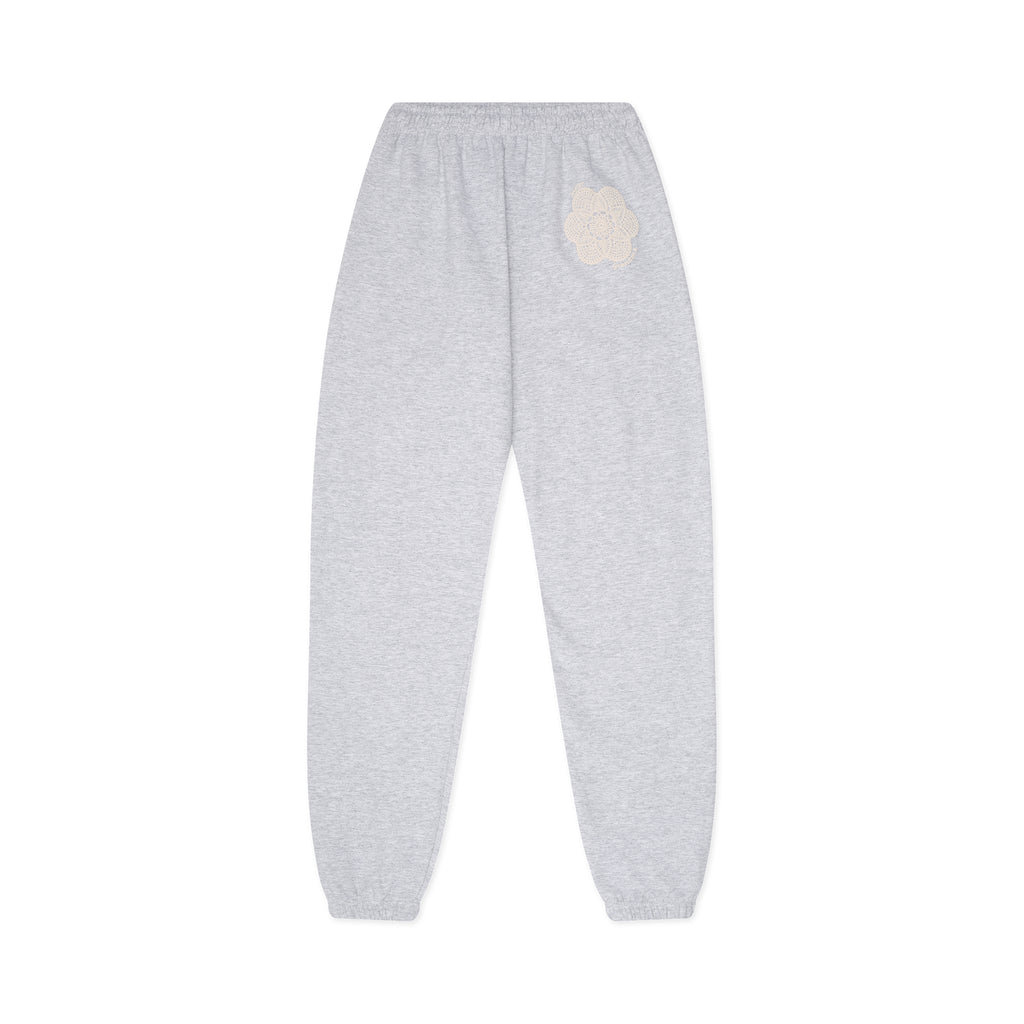 Gray sweatpants with a beige pocket on a white background