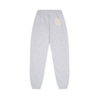 Gray sweatpants with a beige pocket on a white background