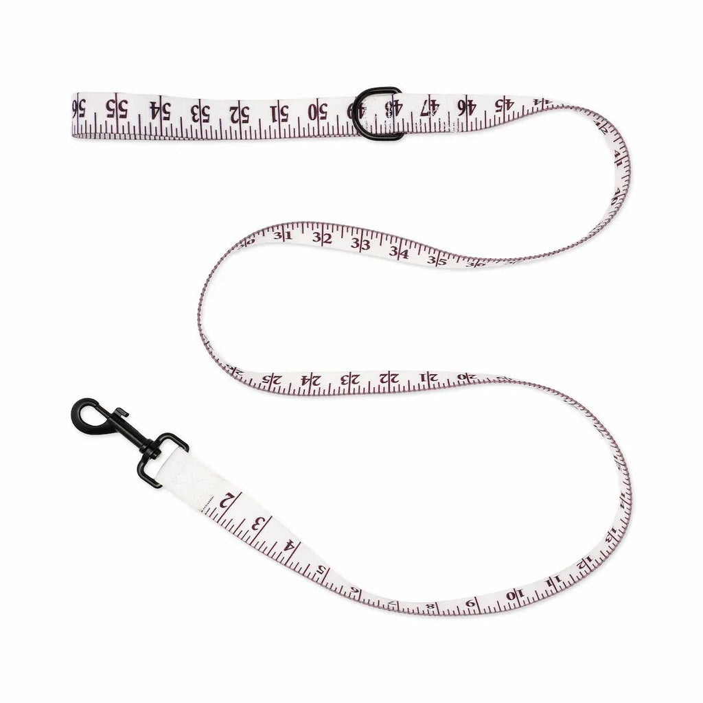 Measurement tape leash with measurement markings on a white background