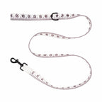 Measurement tape leash with measurement markings on a white background