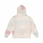 Patchwork hoodie with pink and gray and blue patterns on a white background