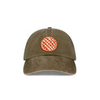 Front view of the Olive green baseball hat with a pie patch on a white backround.