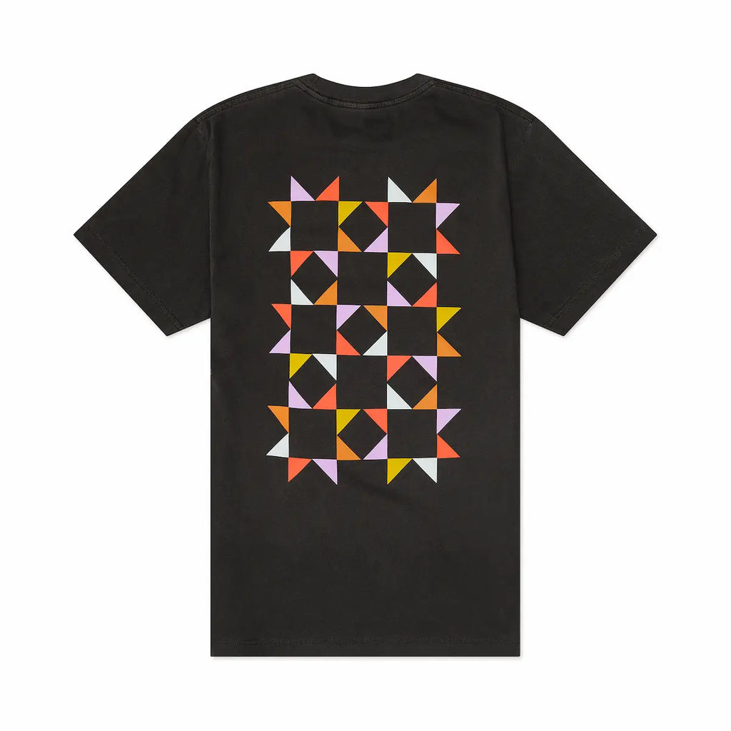 Back view of black t-shirt with colorful geometric  quilt pattern on a white background