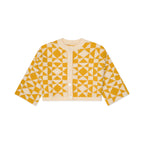 Yellow and white geometric patterned cardigan on a white background