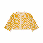 Yellow and white geometric patterned cardigan on a white background