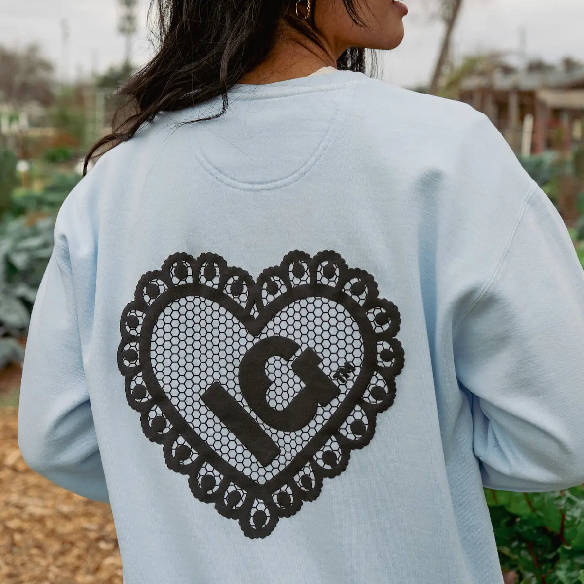 Blue light back view sweatshirt with a puff lace heart with IG in the middle