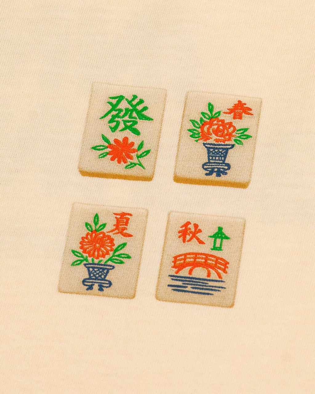 Four wooden tiles with colorful designs and text on a beige background