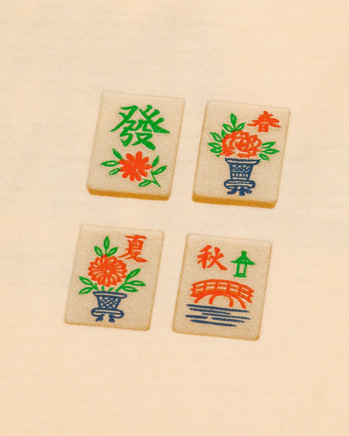 Four wooden tiles with colorful designs and text on a beige background
