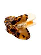Tortoiseshell hair clip on a white background