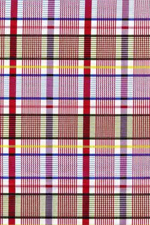 Multicolored plaid pattern with red, yellow, blue, and purple lines.