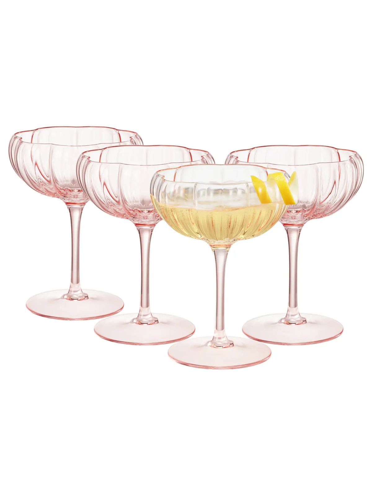 Set of four pink cocktail glasses with a drink inside on a white background