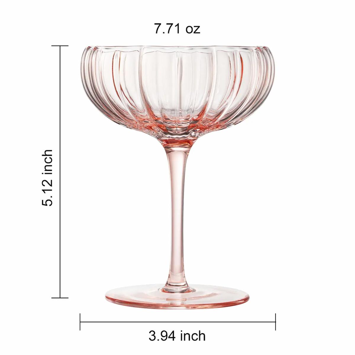 Pink glass coupe with measurements on a white background