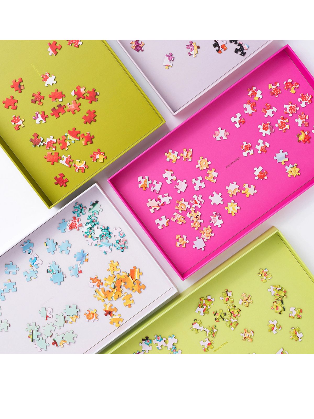 Colorful puzzle pieces in various boxes on a white background