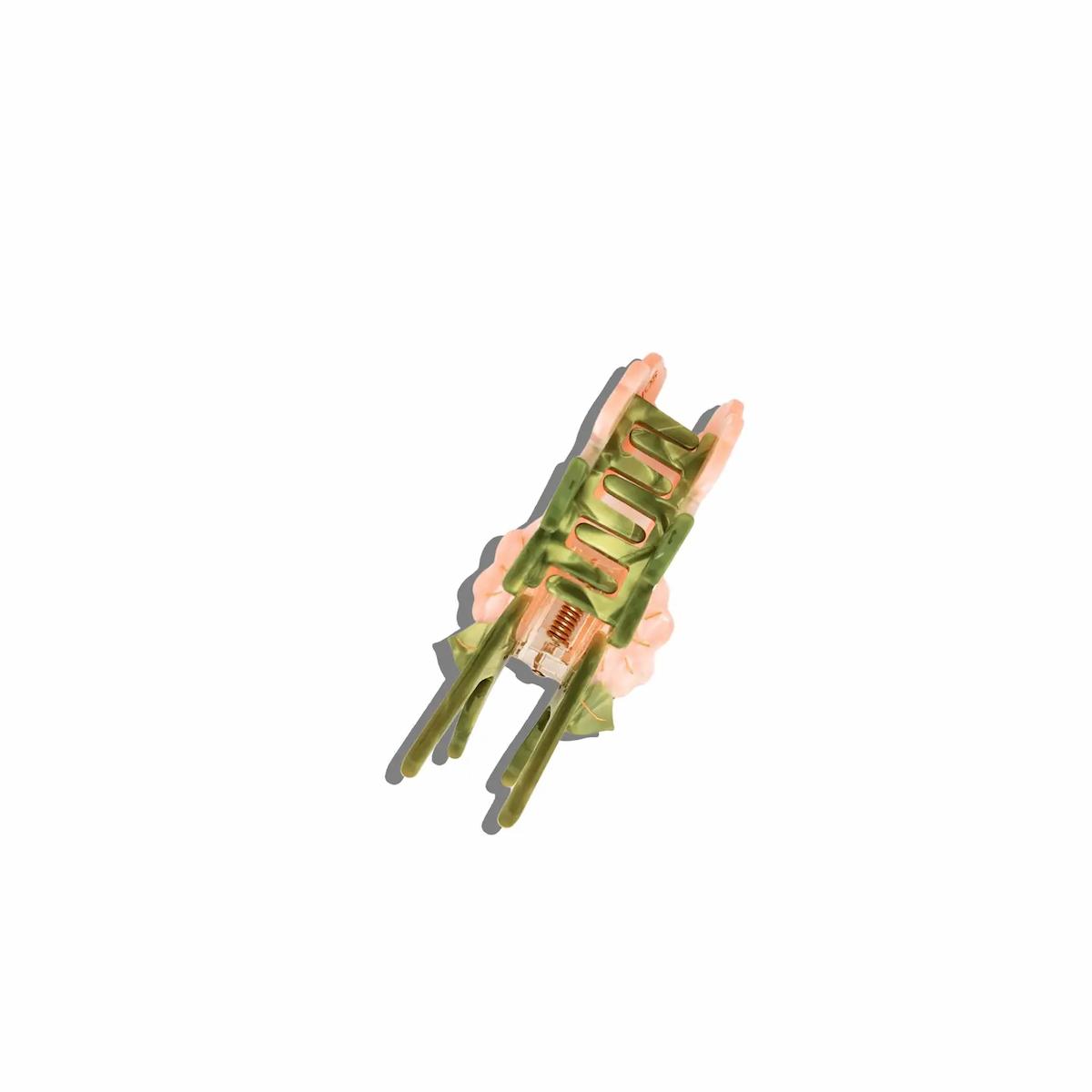 Green and brown tool on a white background