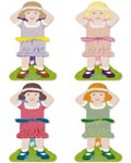 Four thread holders shaped like dolls with different dresses on a white background