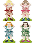 Four thread holders shaped like dolls with different dresses on a white background