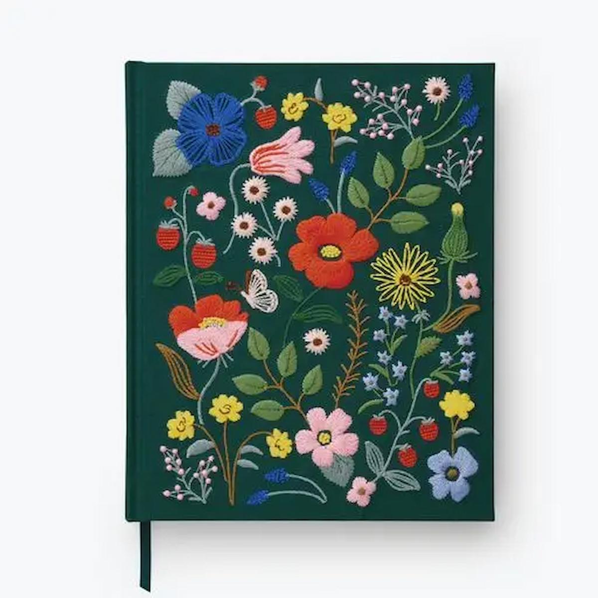 Floral embroidered notebook on a white background