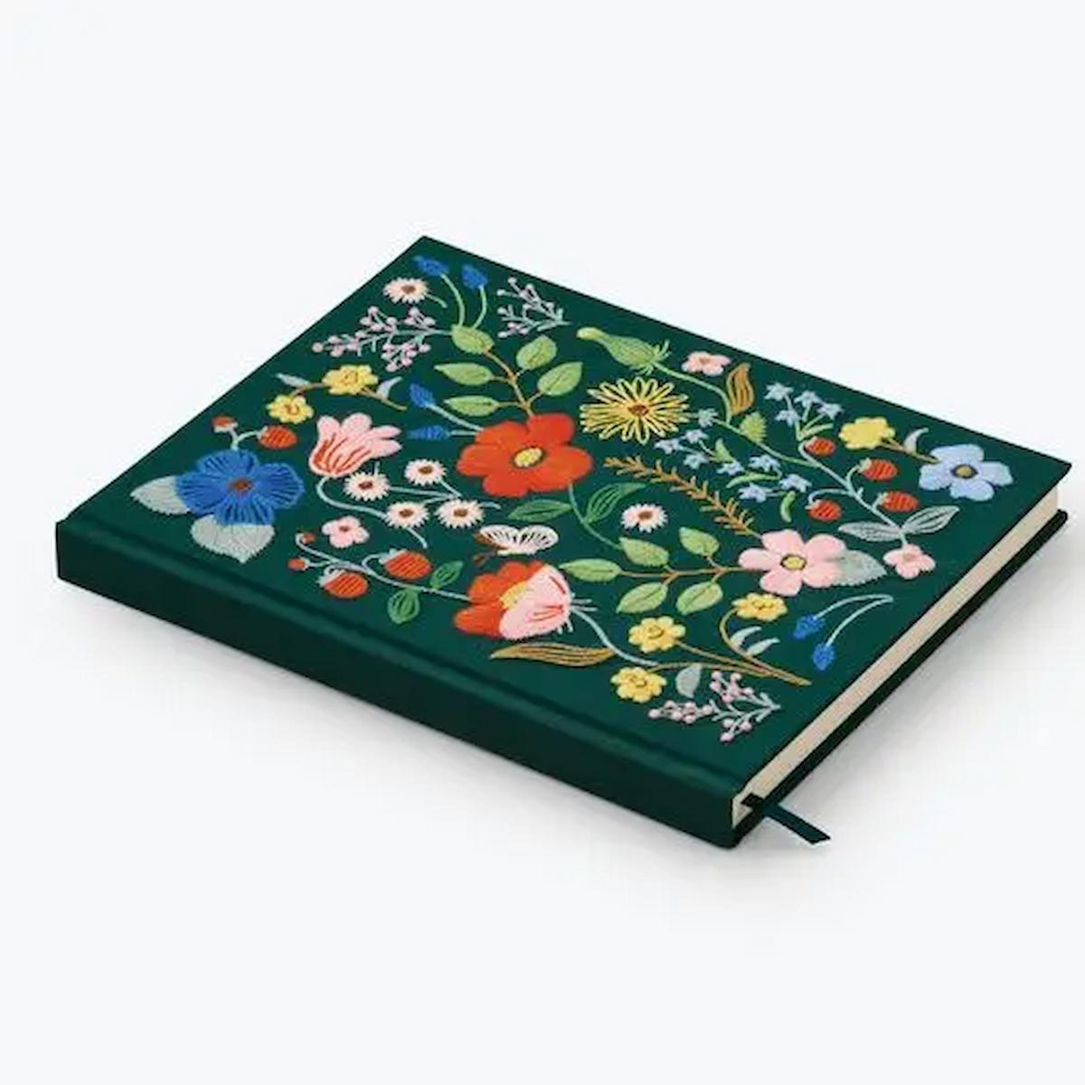 Floral embroidered notebook on a white background