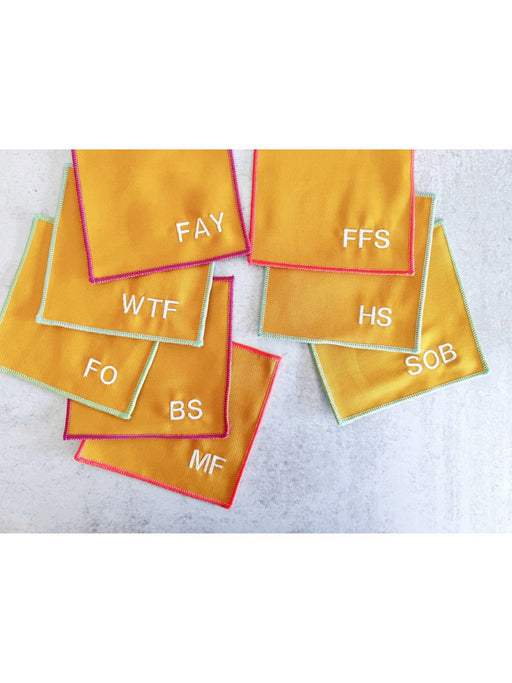Yellow cloth pads with text on a gray surface