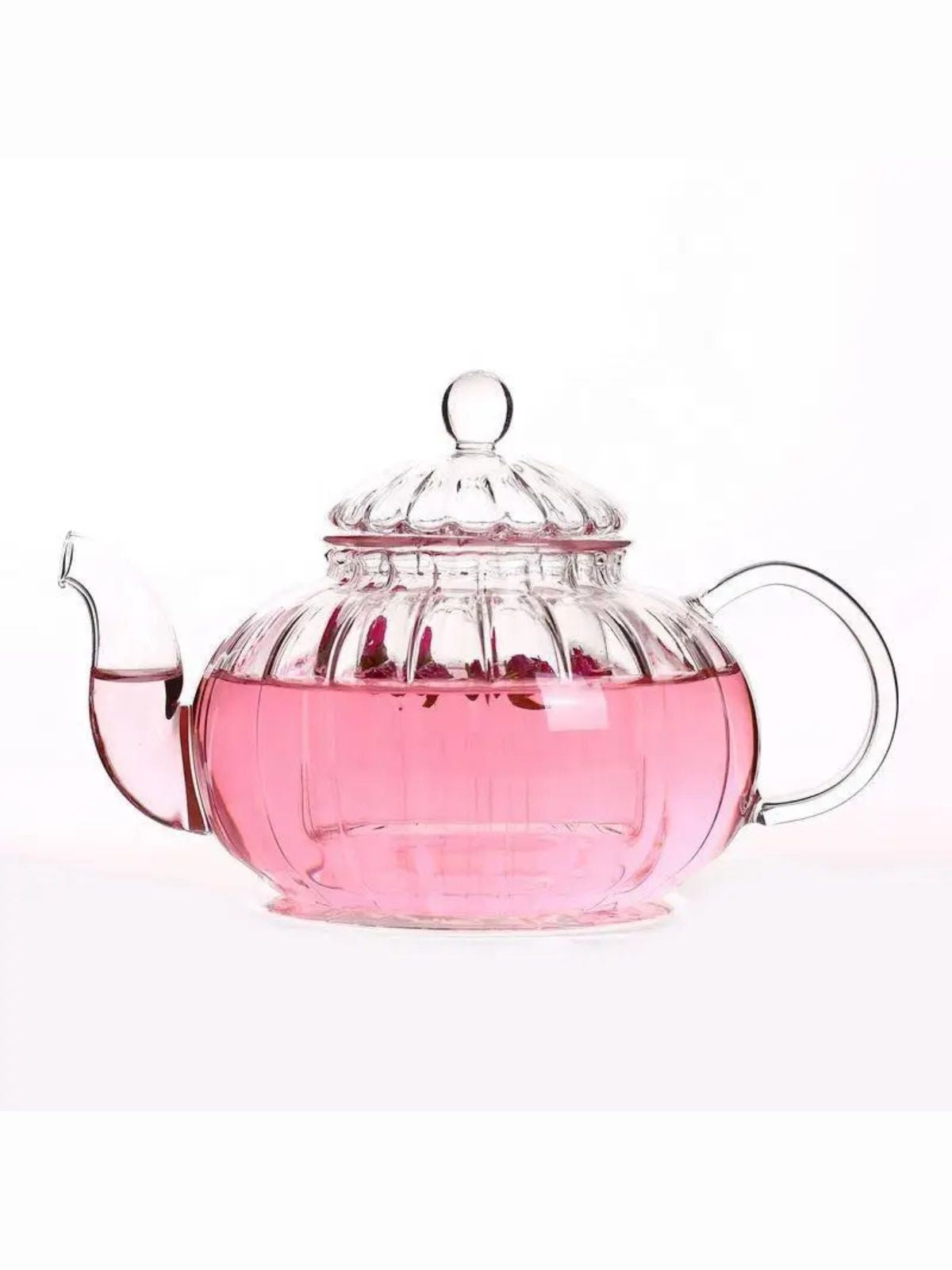 Clear glass teapot with pink liquid on a white background