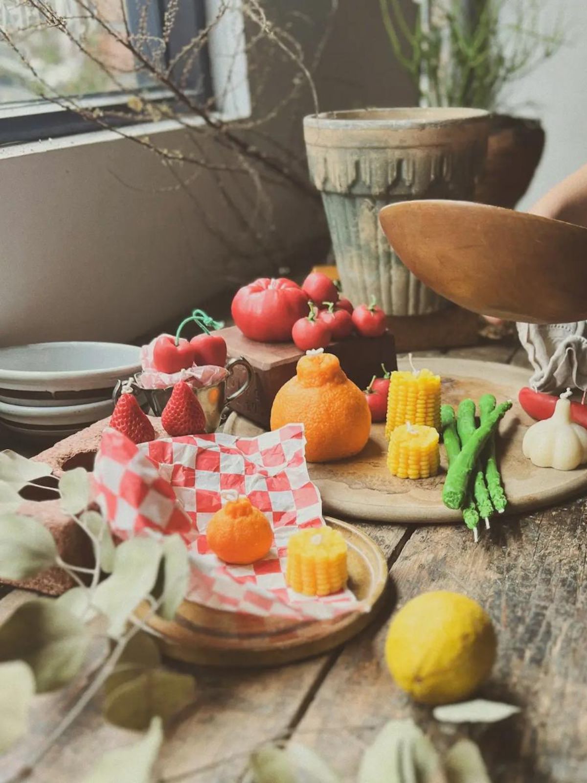 Decorative food items on a wooden table with a cozy indoor setting.